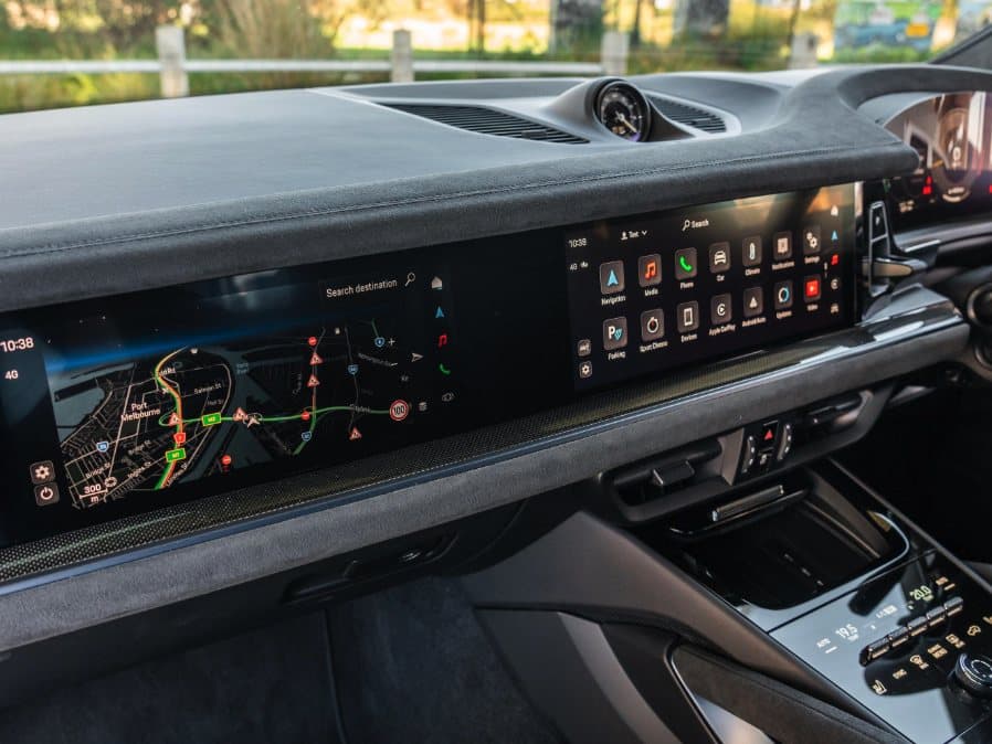 Piano black dashboard trim running the width of a vehicle interior