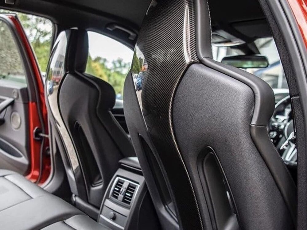Rear seat backs and carbon trim inside a performance vehicle